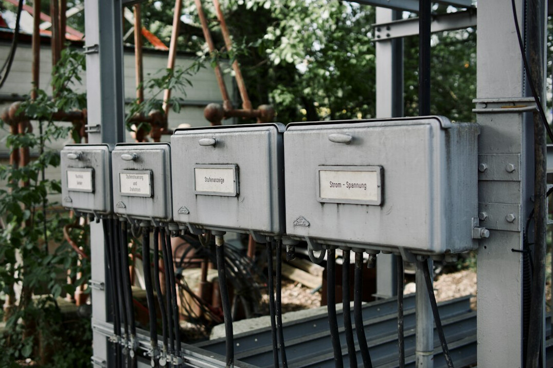 Rack of network equipment with cables and indicator lights